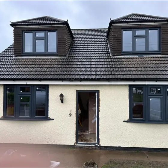 Rendered dormer bungalow with new anthracite grey windows