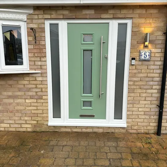 Sage green contemporary composite door with glazed side panels