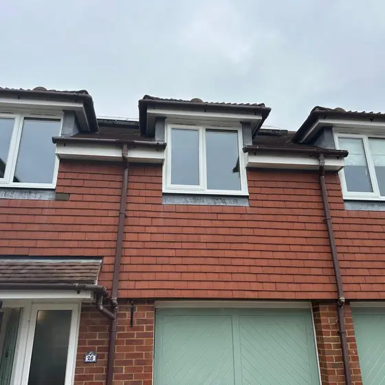 Row of townhouses with new white windows in the dormers