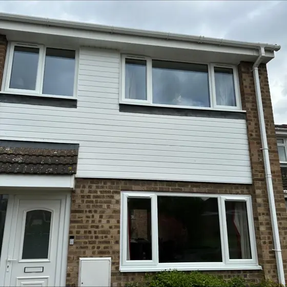 Townhouse with new white uPVC windows on every floor
