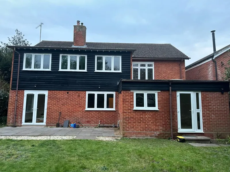 Rear elevation of a house fitted with anthracite grey windows and doors
